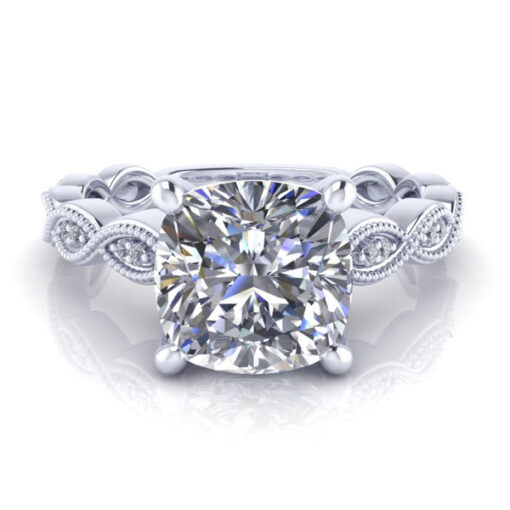 Vintage cushion cut ring in platinum laying in front of white and red roses