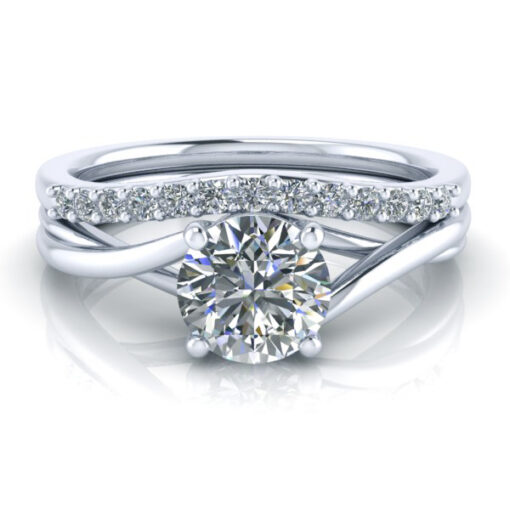 Matching contour diamond wedding ring laying with engagement ring.
