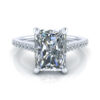 Radiant cut ring with accent diamonds in white gold