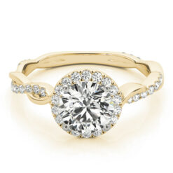 Round cut halo ring with an entwined pave set diamond ring shank in yellow gold.
