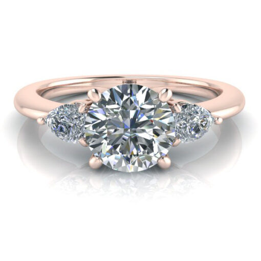 14k rose gold three stone engagement ring with round cut center gem accented by pear shaped shoulder gems.